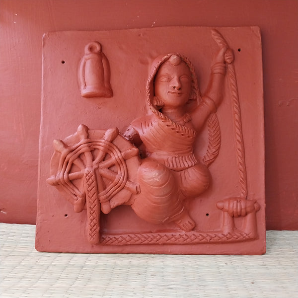 Woman spinning a Charkha - Terracotta Tile