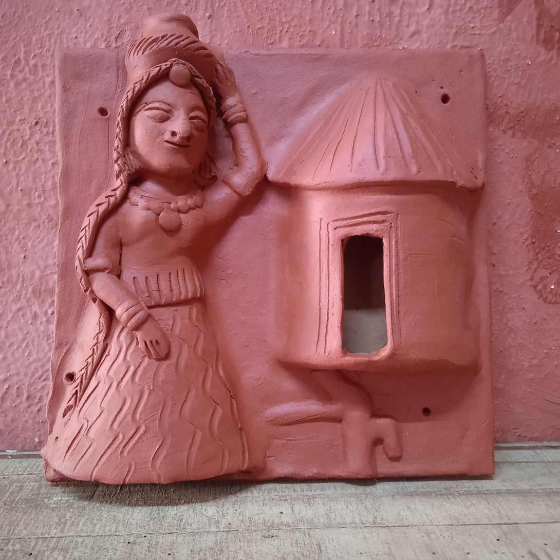 Terracotta woman carrying a water pot